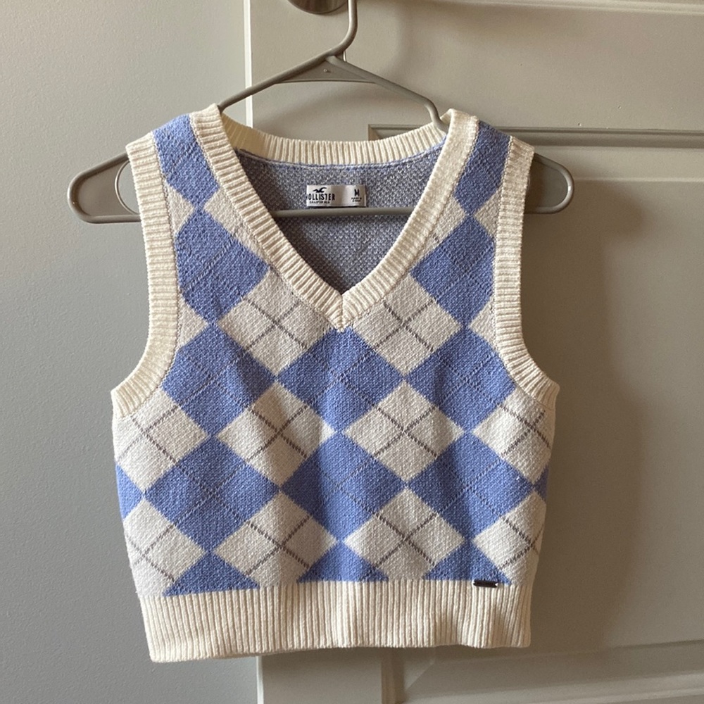 blue and white sleeveless sweater